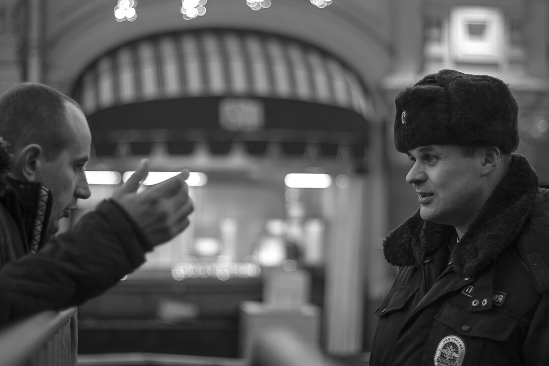 detective talking to store manager