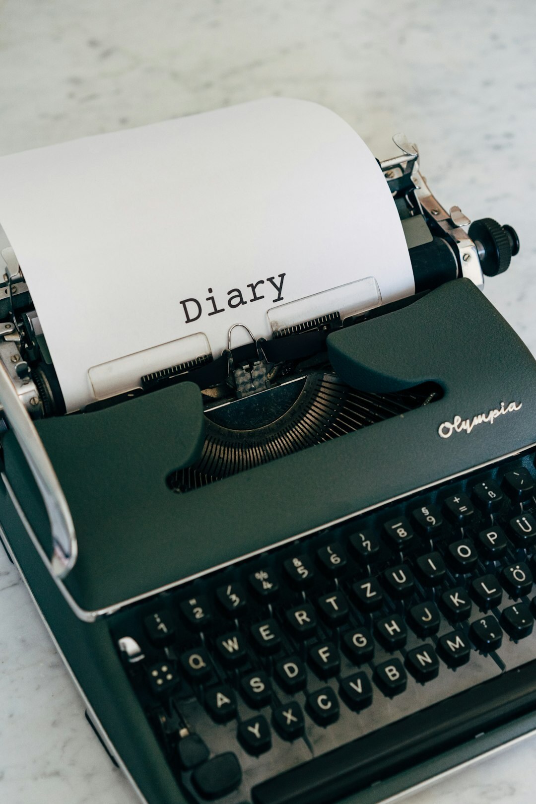 Vintage typewriter and old documents on a desk in an archive room